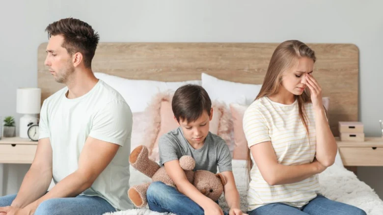 Divorced family on bed