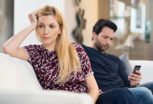 Woman and man on couch