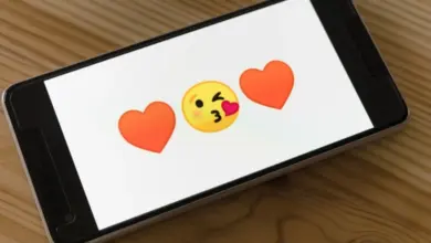 Smartphone with emojis on screen