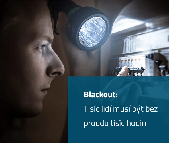 Man with flashlight in dark room