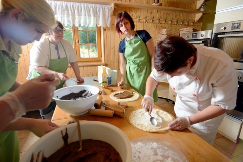 Women making food in kitchen