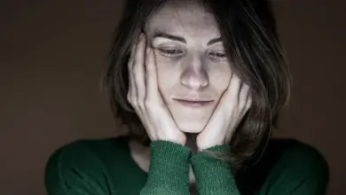 Woman with hands on face