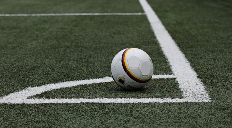 Soccer ball on field corner