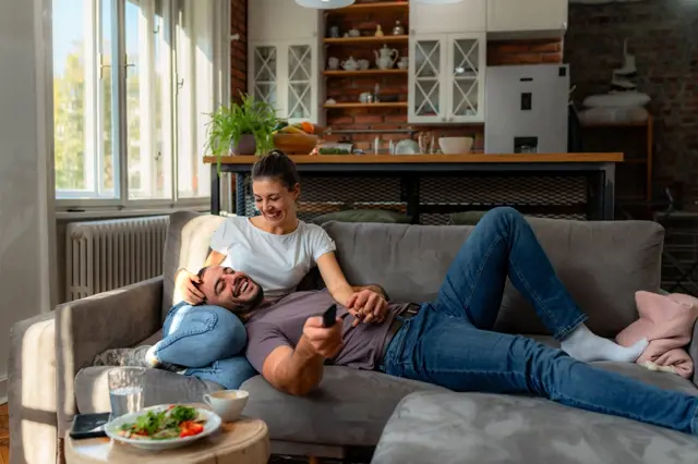 Couple relaxing on sofa
