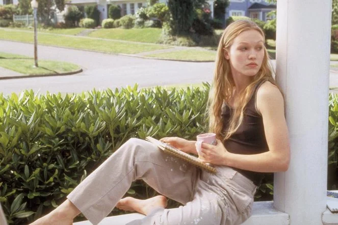 Woman sitting on porch