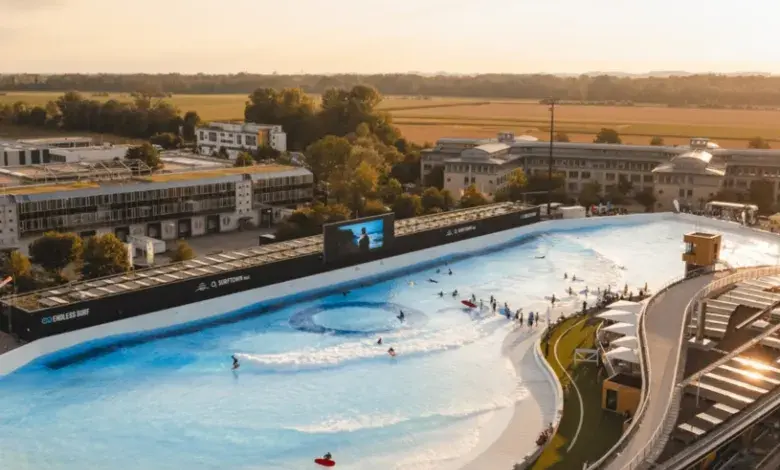 Artificial wave pool with surfers