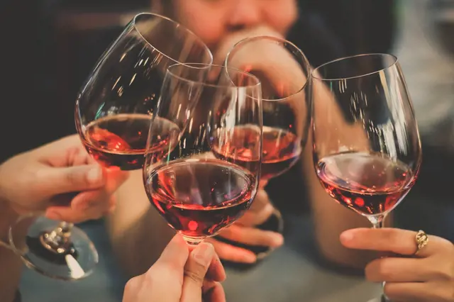 Wine glasses toasting