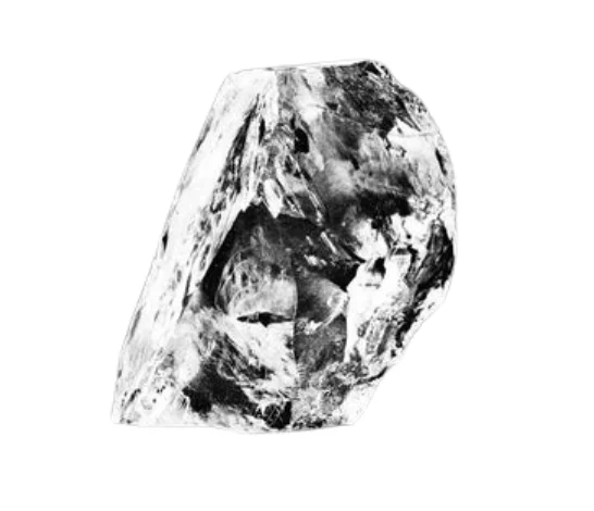 Neupravený hrubý diamant s viditelnými tvary krystalu.