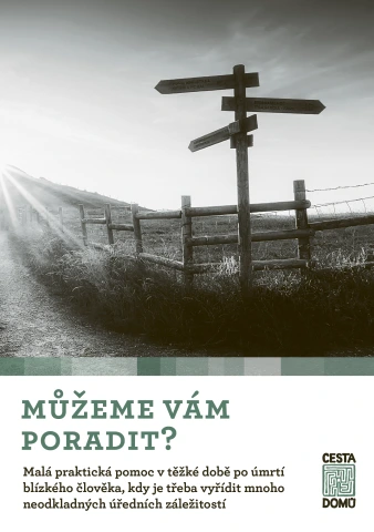 Cesta vedoucí k hrobu s dřevěným sloupkem směrů.