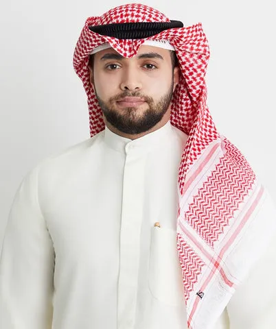 Muž v tradiční arabské pokrývce hlavy s červeno-bílým šálem.